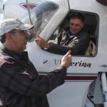 Pilot Burke Mees, left, speaks with Gweduck pilot and co-creator Ross Mahon at the Juneau International Airport on Thursday. The plane is designed like a vintage aircraft, but made with new technology and has been gaining popularity quickly. (Alex McCarthy | Juneau Empire)
