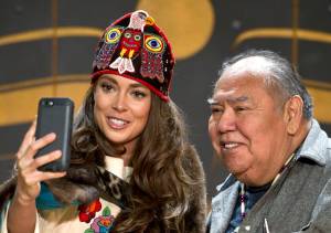 Miss Alaska USA 2017 Alyssa London takes a selfie with elder David Katzeek at the Walter Soboleff Center&rsquo;s Clan House on Feb. 17, 2017. (Michael Penn | Juneau Empire file)