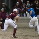 Ketchikan pitcher Jack Carson, left, catches a flyball bunt as Thunder Mountain&rsquo; Bryson Echiverri makes a fun for first base in the third inning at Adair-Kennedy Memorial Park on Friday, May 5, 2017. (Michael Penn | Juneau Empire)