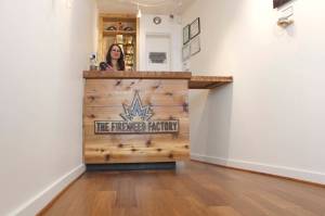 Fireweed Factory Store Manager Emma Harper awaits customers at its shop on Front Street. The marijuana retailer quietly opened Tuesday and business has already been good. (Alex McCarthy | Juneau Empire)