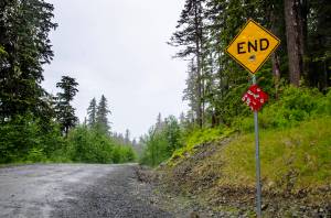 A sign sits at the end of the Juneau road in June 2014. (Marlena Sloss | Juneau Empire File)