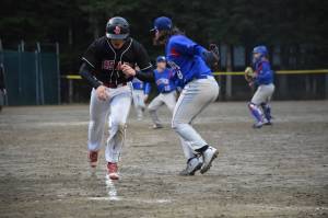 Bryan Miramontes is tagged out by Sitka&rsquo;s Vaughn Blankenship in a rundown Friday at Adair-Kennedy. (Nolin Ainsworth | Juneau Empire)
