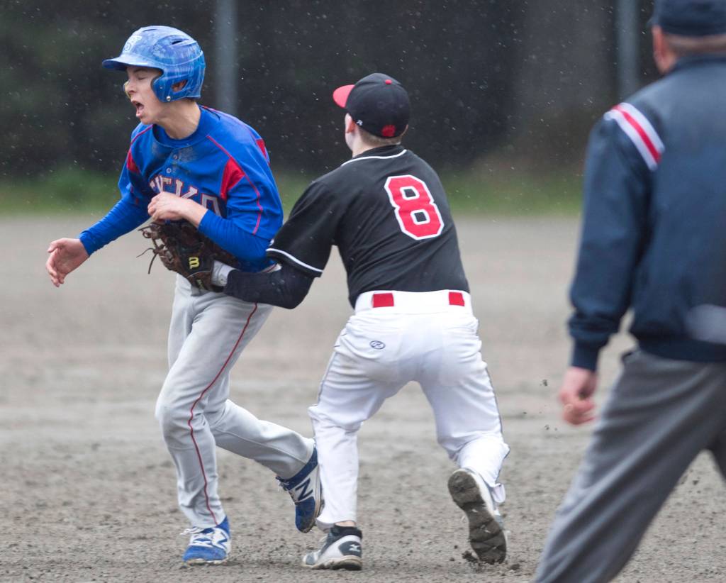 Juneau-Douglas&rsquo; Jacob Dale tags Sitka&rsquo;s Emmitt Andersen out between bases in the second game of a double-header at Adair-Kennedy Memorial Park on Saturday, May 13, 2017. (Michael Penn | Juneau Empire)
