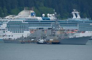 The 505-foot USS O&rsquo;Kane anchors in front of a cruise ship in the Gastineau Channel on Saturday afternoon. (Lance Nesbitt | For the Juneau Empire)