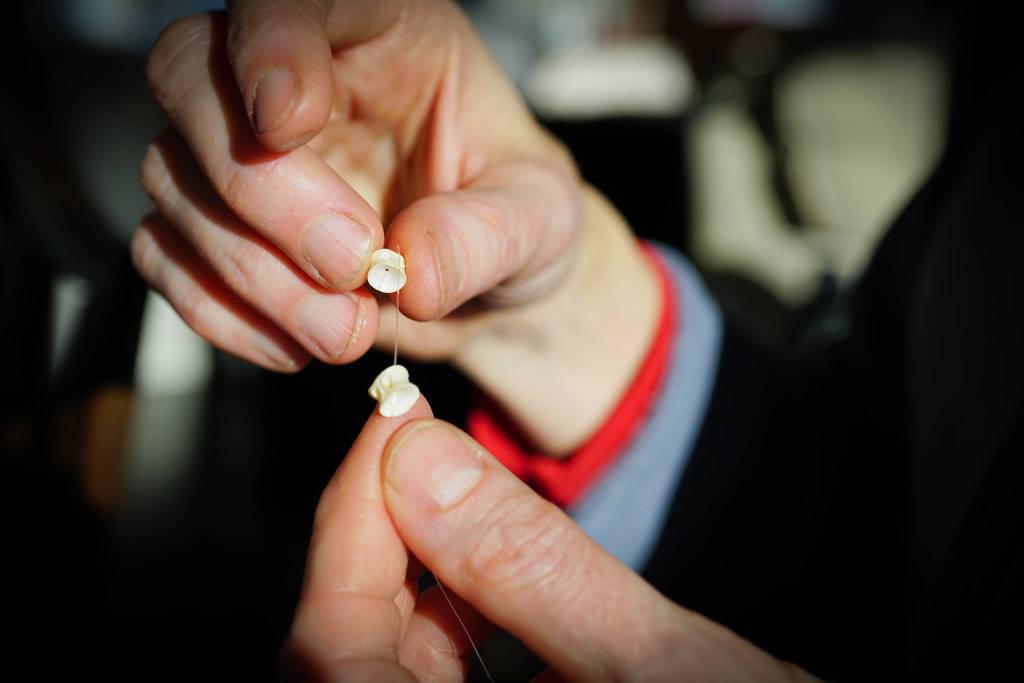 Sitka woman makes dress from 20,000 salmon bones