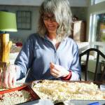 Mia Nevarez stands in front of Crescent Harbor in Sitka wearing a salmon bone dress made by Cynthia Gibson.&nbsp;(Photo by Bethany Goodrich)