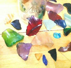Sea glass shards scattered on a table. (Photo by Tara Neilson)