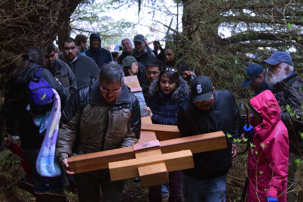 Survivors, friends and family visit the Funter Bay internment camp where of hundreds of Aleutian and Pribiloff Island Alaska Natives were held during WWII. Commemorating the 75th anniversary of the internment, the group installed a &ldquo;healing cross&rdquo; at the grave site of those who perished during their years of internment. (Kevin Gullufsen | Juneau Empire)