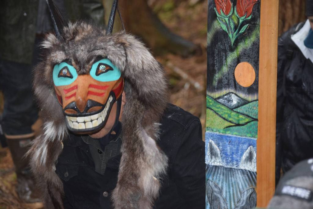 Ben Coronell wears Tlingit regalia at a raising of a &ldquo;healing cross&rdquo; at the 75th-anniversary commemoration of the WWII internment of Aleut Alaska Natives at a site in Funter Bay, on West Admiralty Island. (Kevin Gullufsen | Juneau Empire)