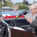 Sen. Dennis Egan cracks a joke during the Mike Pusich Douglas Harbor ribbon-cutting ceremony on Friday as Port Director Carl Uchytil watches. The city completed renovations on the harbor this spring, which now carries the name of the former Douglas mayor who first advocated for the harbor. (Alex McCarthy | Juneau Empire)