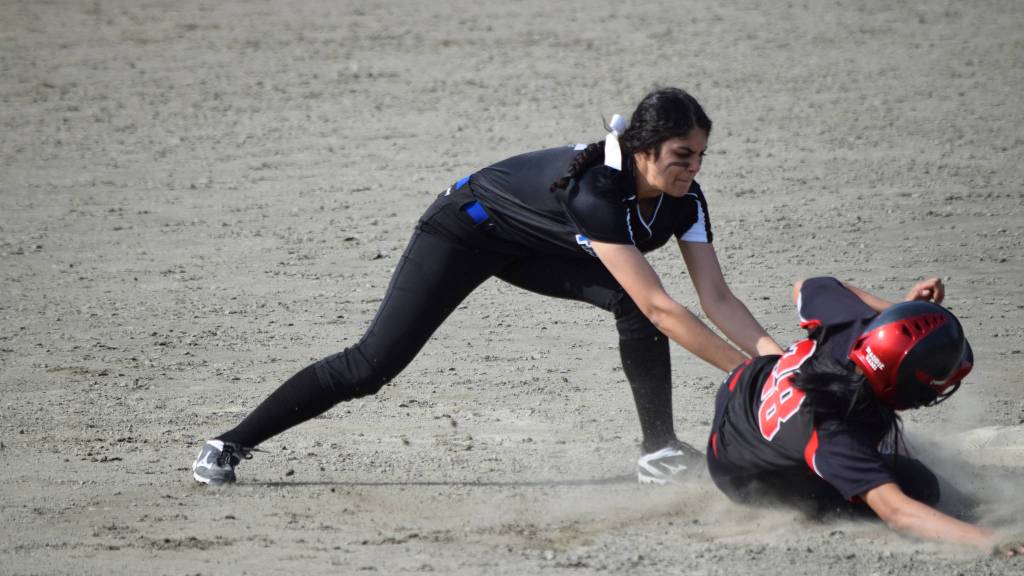 Thunder Mountain High School shortstop Maxie Saceda-Hurt tags out Juneau-Douglas High School&rsquo;s Alyxn Bohulano trying to steal second base at the Region V softball tournament on Saturday, May 27. (Nolin Ainsworth | Juneau Empire)
