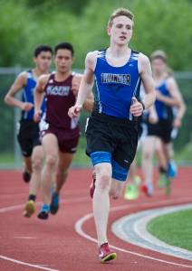In this file photo from May 2016, Thunder Mountain High School&rsquo;s Jonah Penrose rounds a turn during the Region V Track and Field Championships at TMHS. (Konrad Frank | Juneau Empire File)