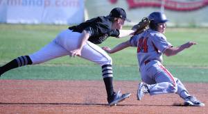 Juneau-Douglas&rsquo; Donavin McCurley is caught in a rundown. (Michael Dinneen | For the Juneau Empire)