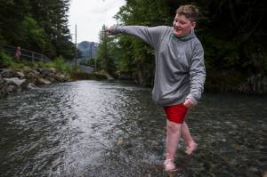 Reilly Hayes, 12, tests out the water of Gold Creek at Cope Park on Friday, June 2, 2017. Hayes&rsquo; thoughts in a word, &ldquo;Cold&rdquo;! (Michael Penn | Juneau Empire)