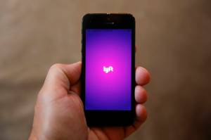 This May 16, 2016 file photo shows a smartphone displaying the Lyft app in Detroit. (Paul Sancya | The Associated Press File)