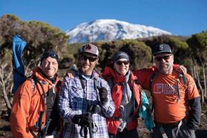 Terry White (far right) poses with other members of Moving Mountains for Multiple Myeloma&rsquo;s climb of Mt. Kilimanjaro. The mountain is the tallest free-standing mountain in the world, meaning it&rsquo;s the tallest that isn&rsquo;t part of a mountain range. (Photo courtesy of John Waller, Uncage the Soul Productions)