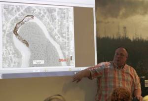 Brett Nelson, the State Conservation Engineer for the Natural Resources Conservation Service, presents to the City and Borough of Juneau Committee of the Whole on Monday. Nelson has been designing a plan to stop erosion on the banks of the Mendenhall River, which is threatening nearly 30 properties. (Alex McCarthy | Juneau Empire)