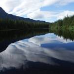 Cloud reflections in Dredge Lakes, early June. (Photo by Linda Shaw)