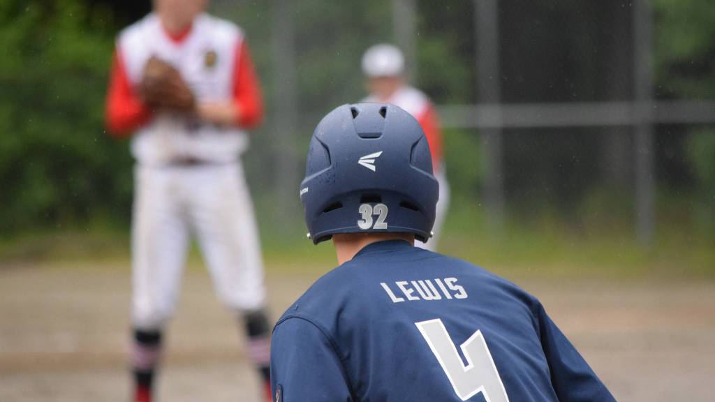 Juneau Post 25&rsquo;s Chandler Lewis leads off from third base. (Nolin Ainsworth | Juneau Empire)