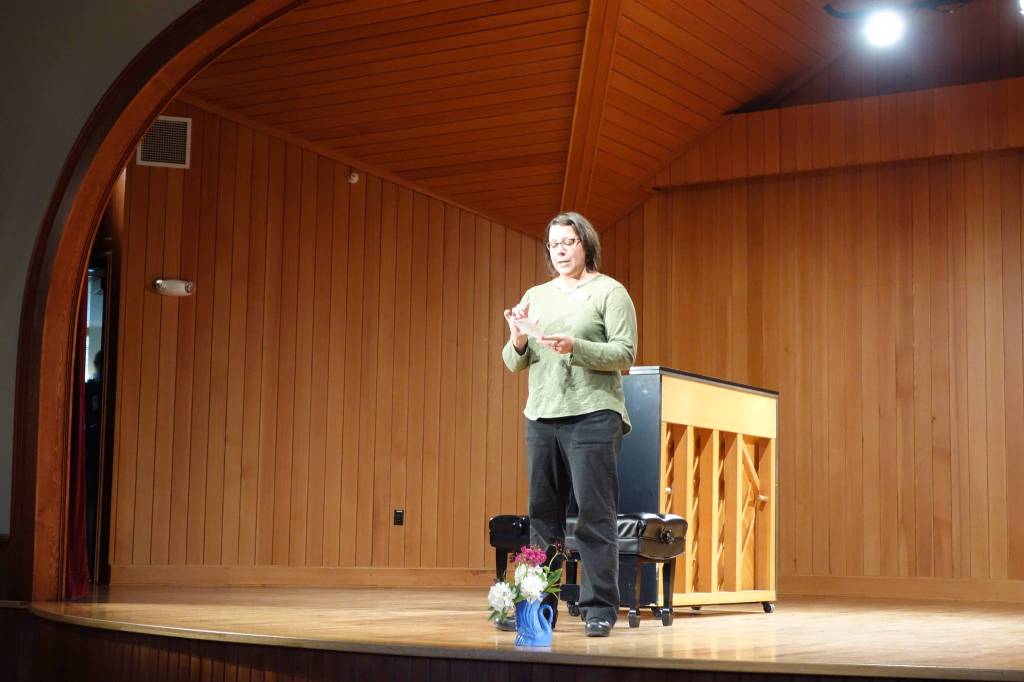 Executive Director Kayla Boettcher speaks at the Sitka Summer Music Festival. (Photo by Mackenzie Fisher)