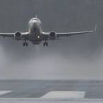 Rain vortexes are created behind an Alaska Airline 737 passenger jet as it takes off at the Juneau International Airport on Tuesday, June 20, 2017. (Michael Penn | Juneau Empire)