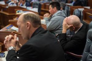 Rep. Gary Knopp, R-Kenai, left, Rep. Daniel Ortiz, I-Ketchikan, right, and Rep. Dean Westlake, D-Kotzebue, listen to debate on the state budget Thursday, June 23, 2017. Both the House and Senate voted to approve a budget and keep the State of Alaska from shutting down on July 1. (Michael Penn | Juneau Empire)