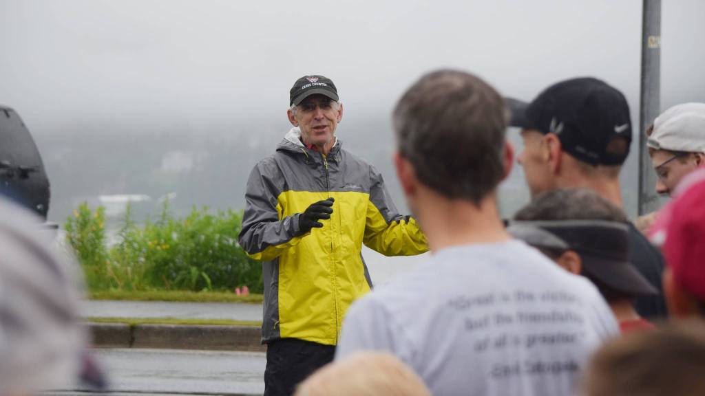 Longtime Juneau-Douglas High School cross country running coach Guy Thibodeau speaks to runners before the Glenn Frick Memorial Mile, Tuesday, July 4, 2017. (Nolin Ainsworth | Juneau Empire)