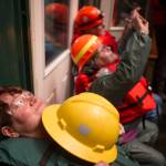 Peggy Reddy watches the fireworks from the barge with other volunteers during the annual city-funded fireworks show in Juneau&rsquo;s downtown harbor on Tuesday, July 3, 2017. (Michael Penn | Juneau Empire)