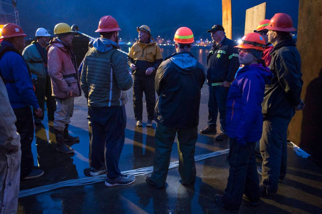 Gary Stambaugh, center, leads a safety briefing with volunteers before the annual city-funded fireworks show in Juneau&rsquo;s downtown harbor on Tuesday, July 3, 2017. (Michael Penn | Juneau Empire)