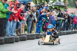 Owen Leighty, 7, makes his soapbox derby run during the 4th of July activities in Douglas on Tuesday, July 4, 2017. (Michael Penn | Juneau Empire)