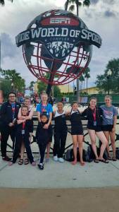 Left to right: Connor Ulmer,19, assistant coach; Kelsey Barker, 12, with Braith Dihle, 9; Sophia Stage-Harvey, 13, with Milina Mazon, 9; Asianna Mazon, 15; Adella Dihle,11; Katrina Taton, 14; and Kiah Dihle, 13. (Photo courtesy of Lesley Kalbrener)