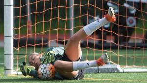 Phallon Tullis-Joyce, the starting goalkeeper for the women&rsquo;s soccer team at the University of Miami, plays with a local women&rsquo;s team at Adair-Kennedy Memorial Field on June 28. Tullis-Joyce is spending the summer conducting fish research as part of a National Oceanic and Atmospheric Administration (NOAA) scholarship program. (Michael Penn | Juneau Empire)