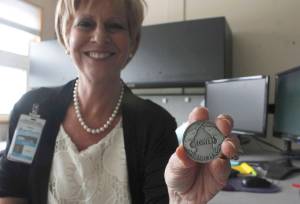 Sally Anne Schneider, departing her position as Chief Behavioral Health Officer at Bartlett Regional Hospital, holds a coin given to patients who complete a program at Rainforest Recovery Center. Schneider says the state of mental health and addiction treatment in Juneau is slowly improving and she&rsquo;s hopeful for the future. (Alex McCarthy | Juneau Empire)