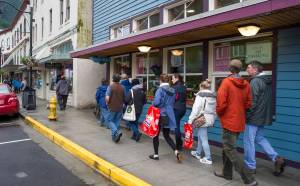 Tourists walk by The Glory Hole, Juneau&rsquo;s soup kitchen and homeless shelter, on Tuesday, July 11, 2017. The city is considering moving The Glory Hole out of downtown. (Michael Penn | Juneau Empire)