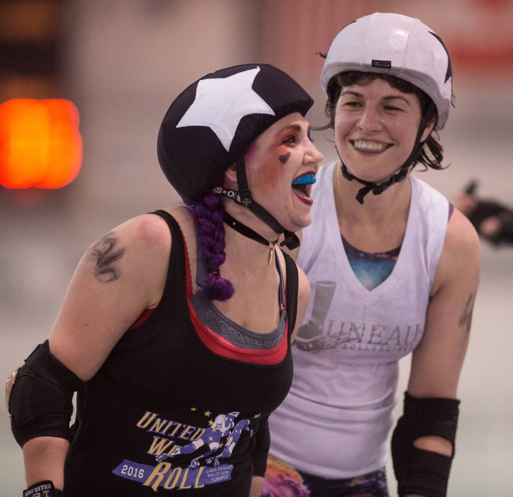 Shari &ldquo;Juke-N-Cherry&rdquo; Dundas, visiting from Anchorage, left, and Rashah &ldquo;Destroyovsky&rdquo; McChesney share a light moment during the Juneau Rollergirls&rsquo; first Mashup of the year at the Treadwell Arena on Friday, July 14, 2017. (Michael Penn | Juneau Empire)