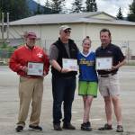The Juneau Softball Association added three State Hall of Fame members last winter and honored them at the 42nd annual Jamie Parsons Memorial Rainball Tournament. From left, Jamie Parsons, Meritorious Service; bank manager Tom Sullivan accepts for1st National Bank Alaska, Sponsor; and far right, Bob Sims, Umpire. (Courtesy photo)