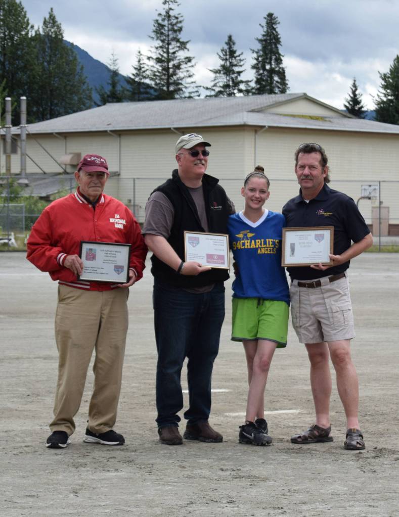 The Juneau Softball Association added three State Hall of Fame members last winter and honored them at the 42nd annual Jamie Parsons Memorial Rainball Tournament. From left, Jamie Parsons, Meritorious Service; bank manager Tom Sullivan accepts for1st National Bank Alaska, Sponsor; and far right, Bob Sims, Umpire. (Courtesy photo)