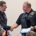 Juneau Chief of Police Bryce Johnson, left, hands out a Lifesaving Award to Officer Brian Dallas during the Juneau Police Department&rsquo;s quarterly awards ceremony on Monday, July 24, 2017. Juneau Chief of Police Bryce Johnson, left, hands out a Lifesaving Award to Officer Brian Dallas during the Juneau Police Department&rsquo;s quarterly awards ceremony on Monday, July 24, 2017.