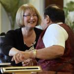 Sen. Anna MacKinnon, R-Eagle River, shakes hands with Sen. Donny Olson, D-Nome, after an agreement in the conference committee at the Capitol on Thursday, July 27, 2017. (Michael Penn | Juneau Empire)