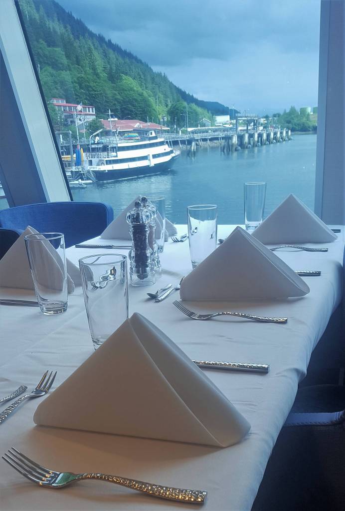 The dining room of the National Geographic Quest features great sightlines through its windows. (Liz Kellar | Juneau Empire)