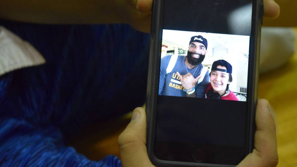 Riley Mayeda, 14, shows off a selfie taken with Carlos Boozer from earlier in the camp. Mayeda said he came to camp because, &ldquo;I knew I had nothing to do.&rdquo; (Nolin Ainsworth | Juneau Empire)