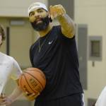 Carlos Boozer talks with incoming Juneau-Douglas High School freshman Cooper Kriegmont Wednesday at camp. (Nolin Ainsworth | Juneau Empire)