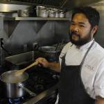 SALT Executive Chef Lionel Uddipa smiles as he prepares his dish for the 2017 Great American Seafood Cookoff. Uddipa will prepare a Dungeness crab risotto to represent Alaska. (Alex McCarthy | Juneau Empire)