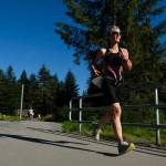 A competitor makes her way to the Auke Lake Trail Saturday during the last leg of the Aukeman Triathlon. (Konrad Frank | For the Juneau Empire)