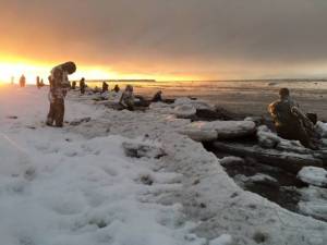 Figures stand at Point Woronzof in the winter of 2015 as part of an art installation by Sarah Davies called 100Stone. (Photo by Sarah Davies)