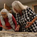 Weavers Delores Churchill (left) and Kay Field Parker examine a Chilkat robe that was donated to Sealaska Heritage Institute. The robe is estimated to be from the late 1800s or late 1900s and is expected to be an important teaching tool for weavers. (Alex McCarthy | Juneau Empire)