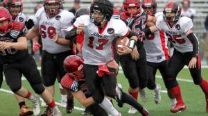 Quarterback Bubba Stults escapes out of the pocket in the Crimson Bears 27-20 win over Houston High School. (Photo courtesy of MatSuSports)