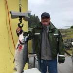 Golden North Salmon Derby winner Don Zenger poses at Amalga Harbor with his 18.8-pound, Derby-winning coho salmon on Aug. 12, 2017. (Courtesy Don Zenger)