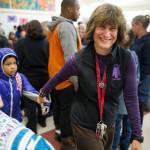 Principal Michelle Byer helps first-grader Laila George through the crowd during the first day of the school at Riverbend Elementary School on Wednesday, Aug. 16, 2017.