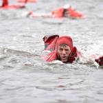A Coast Guard member gasps for air while competing in the survival swim relay during the Buoy Tender Roundup Olympics in Juneau on Wednesday. Crews aboard Coast Guard buoy tenders in Alaska service 1,350 navigational aids along 33,000 miles of coastline while actively participating in search and rescue, environmental protection and law enforcement missions. (Petty Officer 1st Class Jon-Paul Rios | U.S. Coast Guard)